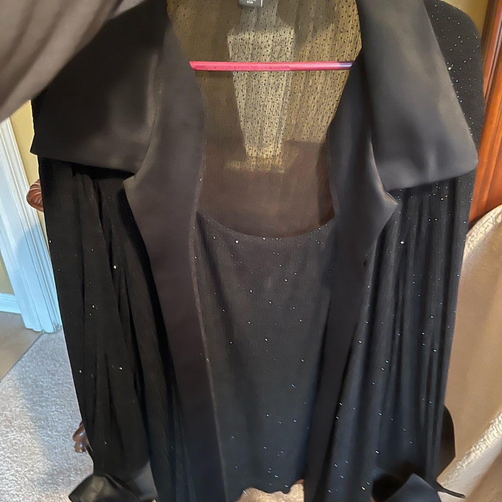 Elegance sparkly woman's long sleeve blouse. Tank underneath is attached.